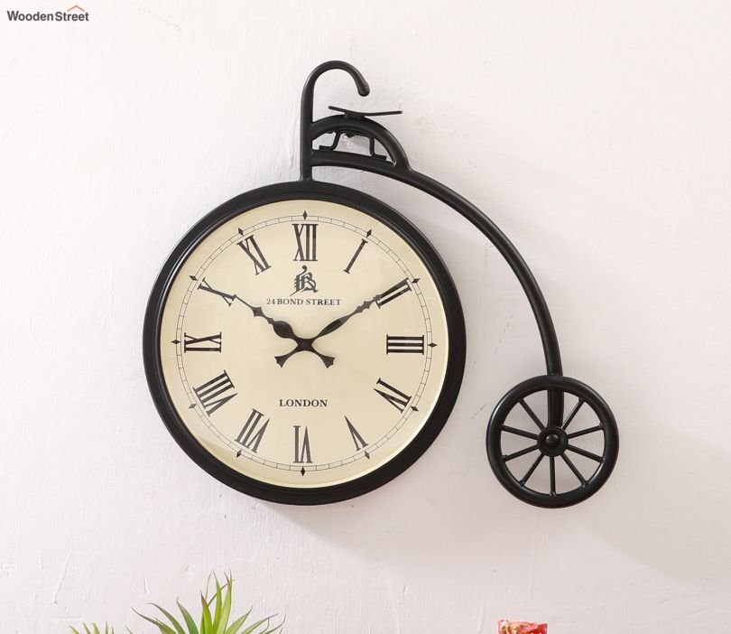 b1-810x702 (1) Miller Cycle Shaped Analog Metal Wall Clock - Image 1